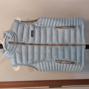 Patagonia puffy vest, light blue with gold accents, size medium